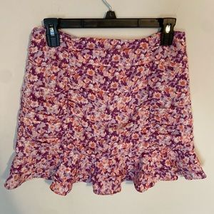 Ruched flippy mini skirt in lilac floral